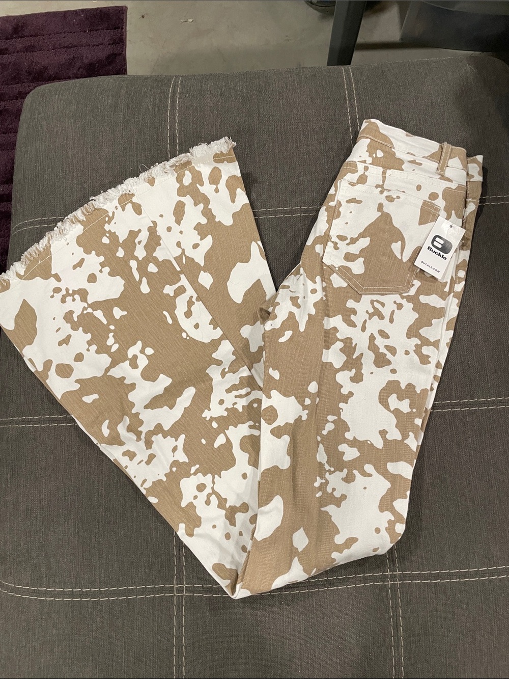 Buckle Cow Print flare jeans